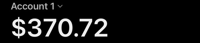 A black screen displays a financial account balance showing "Account 1" with a value of "$370.72" in white text.