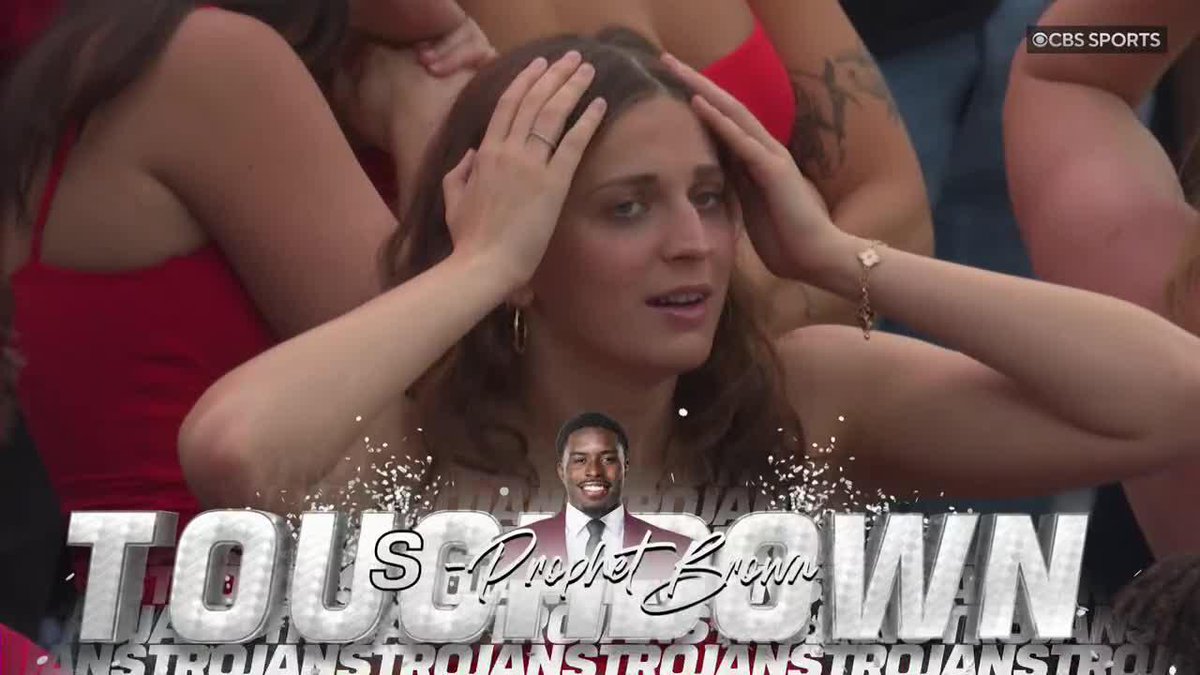 A screenshot from CBS Sports shows a woman with her hands on her head in shock, with overlay text reading 'TO SCARE TROJANS' and 'Prophet Brown' featuring a man's portrait.