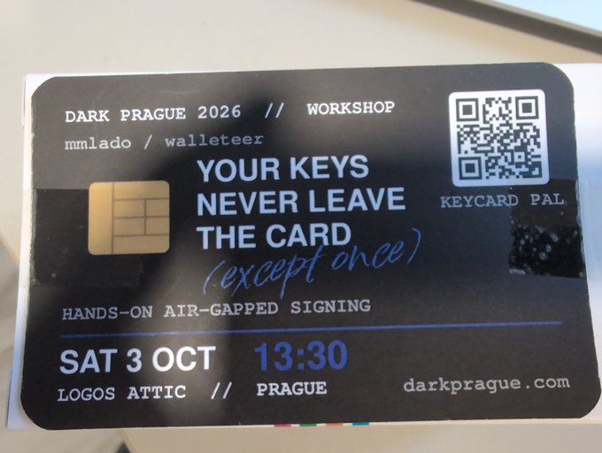 A black promotional card for 'DARK PRAGUE 2026' workshop featuring Keycard Pal, stating 'YOUR KEYS NEVER LEAVE THE CARD (except once)' for a hands-on air-gapped signing on SAT 3 OCT 13:30 at Logos Attic // Prague.