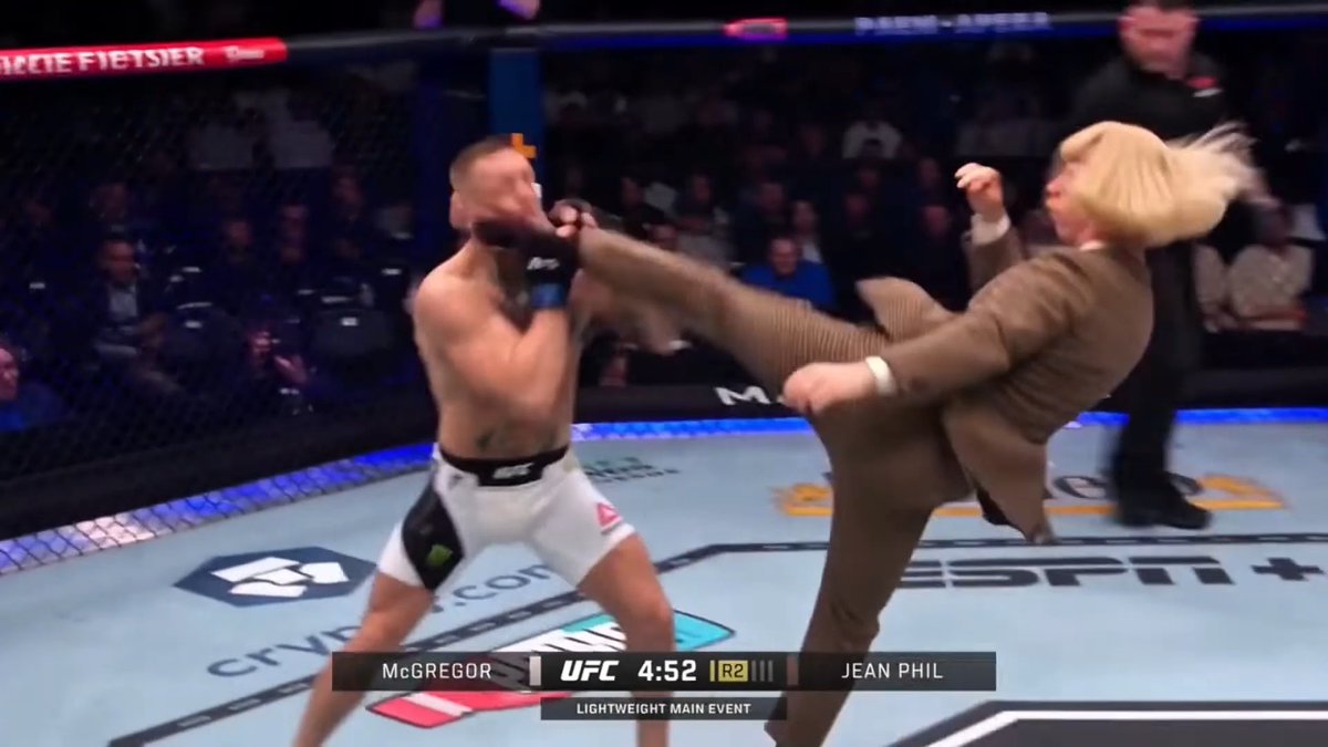 A UFC fight scene labeled 'McGREGOR' vs 'JEAN PHIL' at 4:52 in Round 2, showing a fighter in a brown suit performing a high kick against an opponent.
