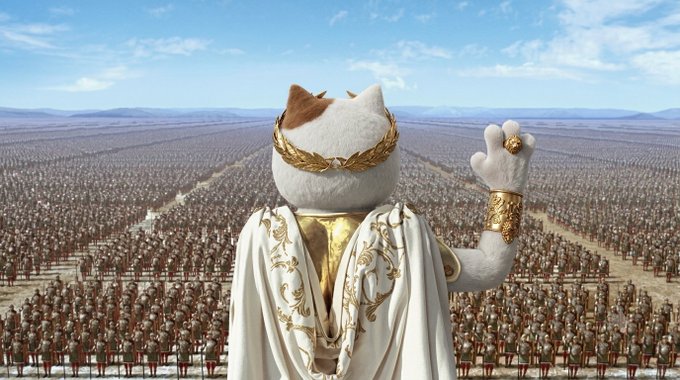 A regal white cat wearing an ornate gold laurel wreath and flowing white-and-gold robes stands with one paw raised, overlooking a vast army of soldier cats stretching to the horizon. The image humorously personifies a triumphant "cat army" victorious in battle, aligning with the post's playful declaration that "The cats won."