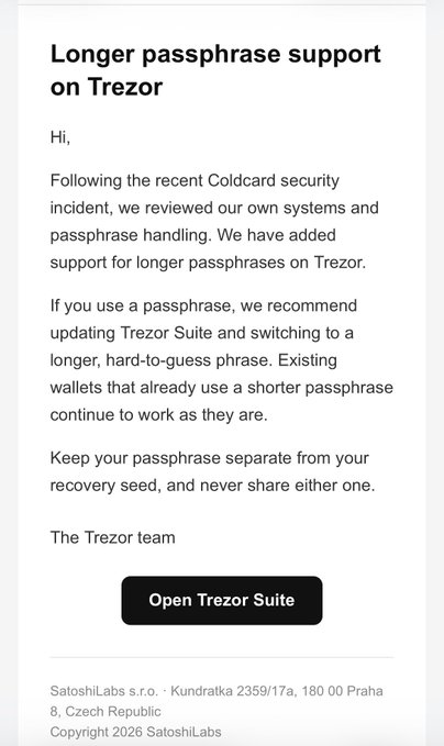 An email notification titled 'Longer passphrase support on Trezor' from SatoshiLabs, advising users to use longer, harder-to-guess passphrases following a Coldcard security incident.