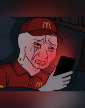 A Wojak-style meme image showing a crying, bloodied face wearing a red McDonald's cap and uniform, illuminated by the red glow of a smartphone in a dark setting.