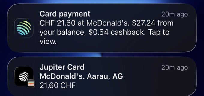 Mobile notifications showing a Jupiter Card payment at McDonald's Aarau, AG for CHF 21.60, with $0.54 cashback.