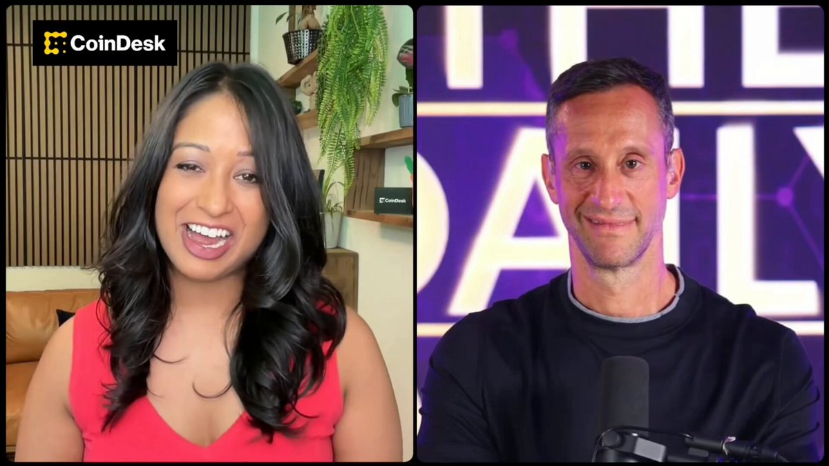 The image shows a man and woman sitting next to each other with microphones in front of them, suggesting they are participating in an interview or discussion. The background features a purple sign that reads "The Daily", indicating this could be part of a podcast or radio show. The focus on their expressions and body language suggests the conversation is engaging and thought-provoking.