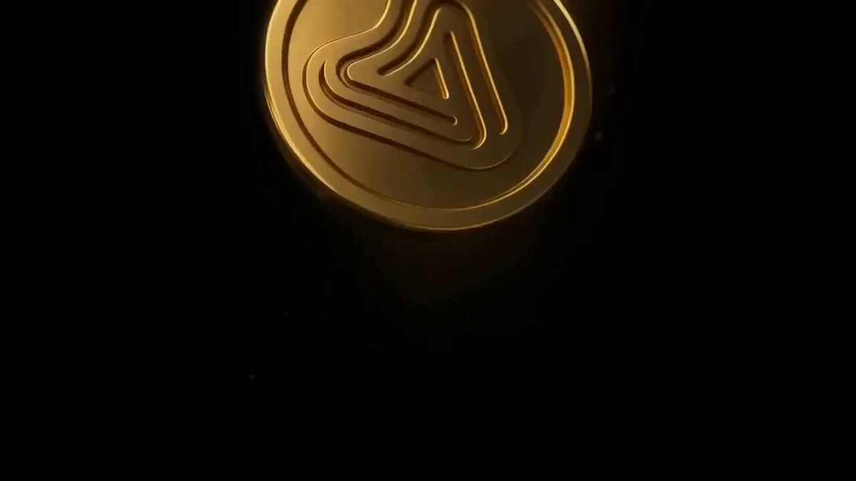 The image features a circle with a triangle symbol inside, set against a black background. There's an "Airdrop" icon below this logo, indicating that this is a promotional piece for an event or product, possibly related to cryptocurrency. The background of the image shows a stark contrast between the dark and light elements within it, emphasizing the prominence of the golden coin symbol.
