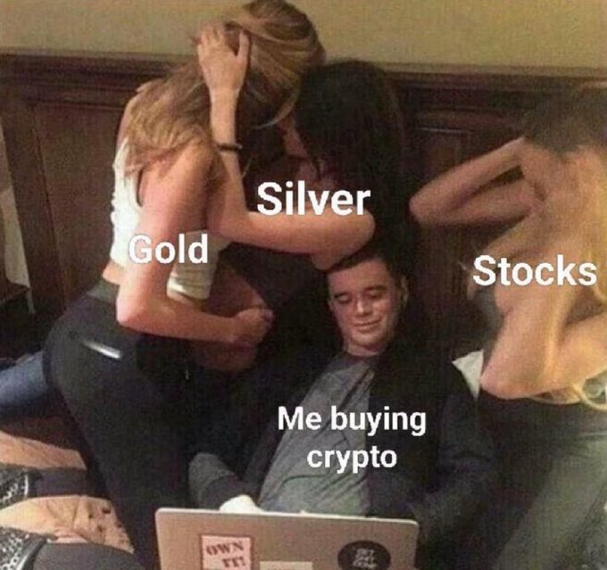 A meme showing a man on a laptop ("Me buying crypto") surrounded by people labeled "Gold," "Silver," and "Stocks," humorously suggesting that crypto is the one getting his attention over traditional investments. The cheerful "GM to Everyone Happy Friday!" post pairs with the meme's lighthearted take on Friday trading enthusiasm, where crypto steals the spotlight from more conventional assets.