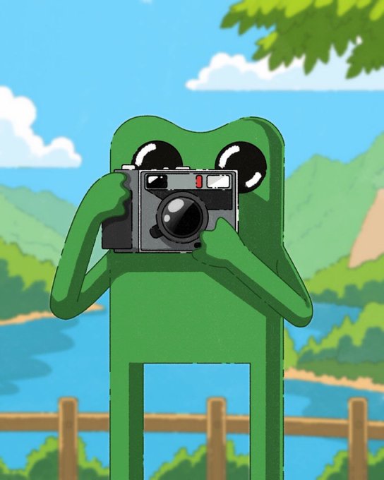 An illustration of a green frog-like character holding a vintage camera up to its face, standing in a scenic landscape with mountains, a lake, and blue sky.