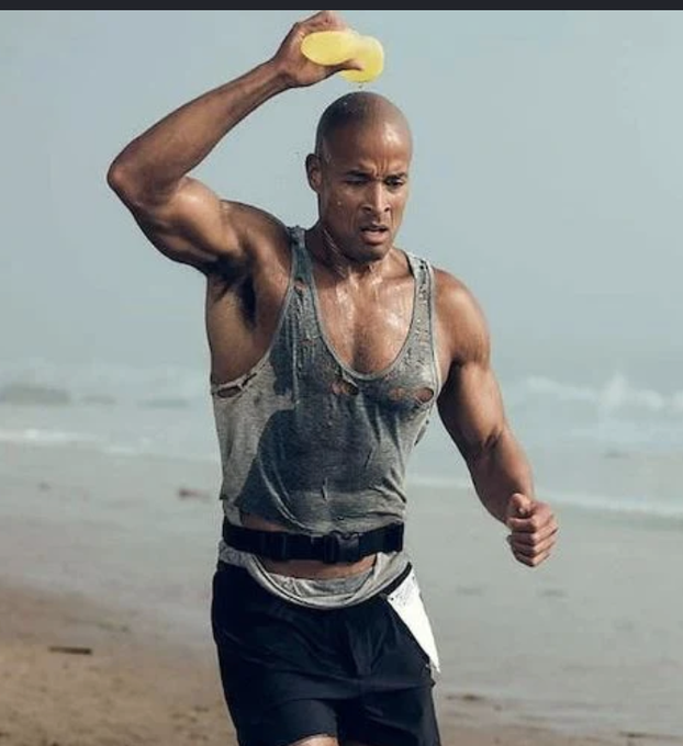 A muscular man pours water over his head while running on a beach, symbolizing the exhaustion of Bitcoin ETF sellers who are dumping shares amid $1.34 billion in weekly outflows and shrinking holdings of 1.2 million BTC. The image captures the physical strain and weariness of investors waking up to disappointing returns after being sold on promises of 30% annual growth.