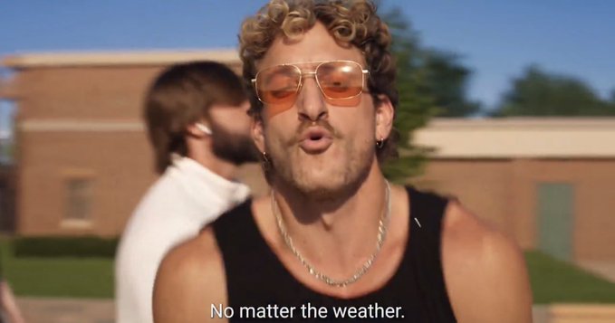 A curly-haired man wearing orange-tinted sunglasses and a black tank top sings, with the subtitle 'No matter the weather.'