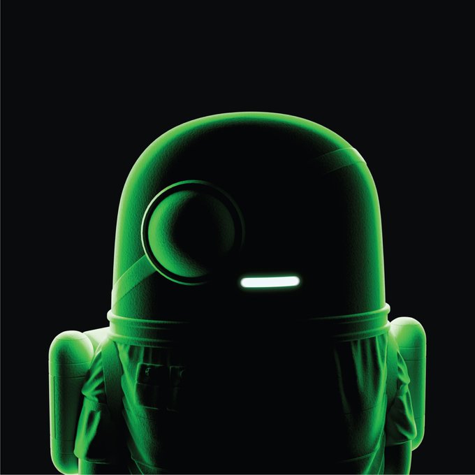 A 3D render of a character wearing a green and black spacesuit or hazmat suit with a large circular helmet feature and a glowing green visor against a black background.