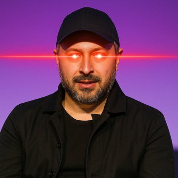 A bearded man wearing a black cap and jacket stares directly at the camera with glowing red laser beams emitting from his eyes, set against a purple background—evoking a powerful, competitive intensity fitting for Anatoly Yakovenko's bold declaration that Solana aims to "win in all trading," including perpetuals.