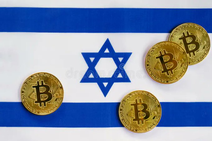 Four Bitcoin gold-colored coins arranged on top of the flag of Israel.