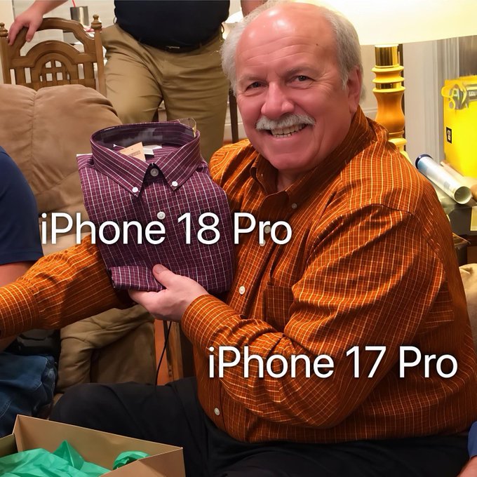 A meme photo of an older man holding a purple shirt labeled 'iPhone 18 Pro' while wearing an orange shirt labeled 'iPhone 17 Pro', referencing Apple's incremental design updates.