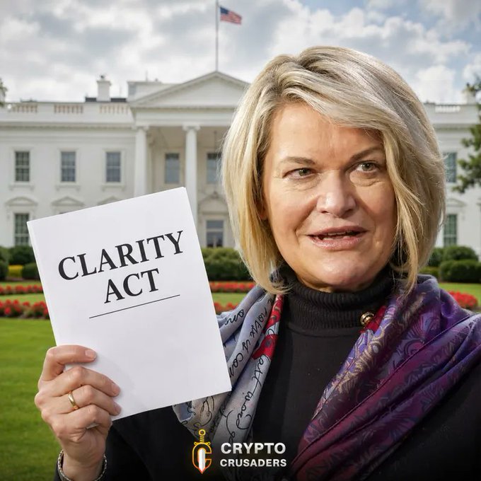 Cynthia Lummis holds up a "CLARITY Act" document in front of the White House, smiling as she announces progress on the bipartisan crypto legislation that aims to establish clear regulatory rules for digital assets like $XRP.