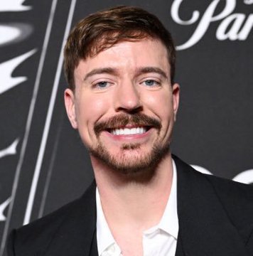 The image shows YouTuber MrBeast smiling on what appears to be a red carpet at an event. The accompanying post uses his name and likeness to promote a cryptocurrency scheme falsely claiming an official "MrBeast" coin ($BEAST) presale — a common scam tactic that misuses celebrity images to deceive investors.