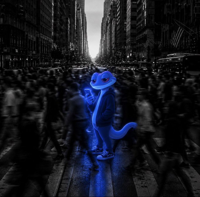 A blue cartoon lizard/gecko character wearing a hoodie stands on a crosswalk in a black-and-white busy city street, glowing with blue light while looking at a smartphone.
