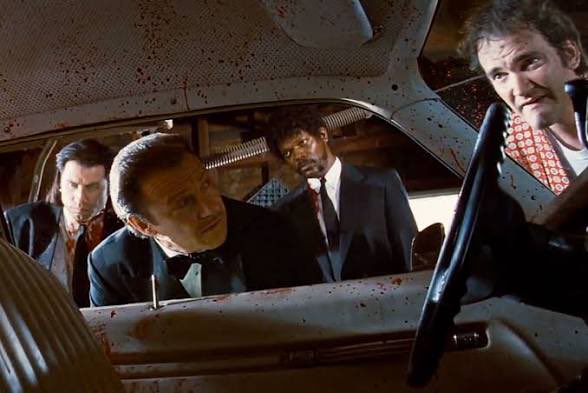 A group of men, including actors Wesley Snipes and Samuel L. Jackson, are seen in a car that appears to be covered in blood. The image serves as a humorous metaphor for the chaotic and volatile state of the cryptocurrency market.