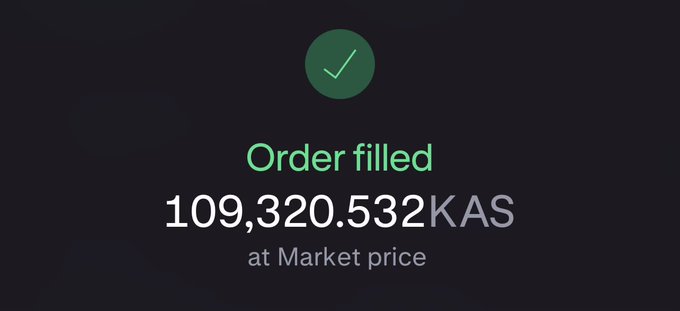 The image shows a post with a message that reads "Order filled 100,320,532 KAS at Market Price". The post has a green checkmark symbolizing a successful order placement. The text indicates that the order was placed for 100,320,532 KAS and is still in an accumulation phase. It will take some time before the full amount of the payment arrives, as it takes time to process and clear the funds from the seller's account.