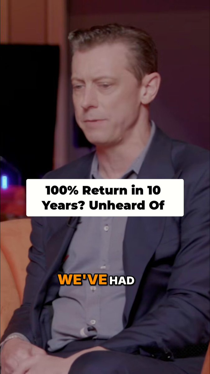 In this image, there's a man sitting indoors with an orange couch nearby. The background includes a television screen displaying the text "@SALTLending : 10 Years, 3 Bear Markets, 100% Paid Back A decade in, SALT Lending has weathered 3 full bear markets and 7 major drawdowns and still returned 
100% to lenders." This image seems unrelated but is meant to be part of a larger post.