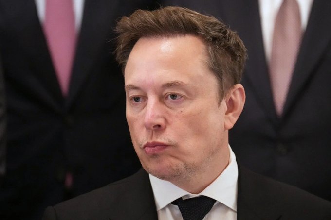 A close-up of Elon Musk in a dark suit, looking serious and contemplative, paired with one of his iconic quotes about persistence: "When something is important enough, you do it, even if the odds are not in your favor." His determined expression visually reinforces the message of perseverance against the odds.