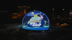A blue glass dome displaying 'Twister Site' with a cartoon character sits at night, surrounded by an orange cat-like figure and what appears to be a bee, with a city skyline in the background.