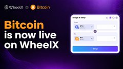 A promotional graphic announcing 'Bitcoin is now live on WheelX' with the WheelX handle @WheelX and a Bitcoin orange logo in the top left.