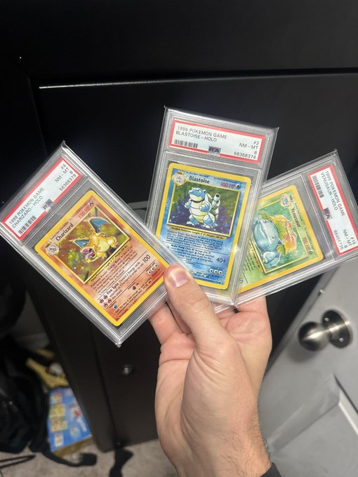 A hand fans out three PSA-graded Pokémon cards: “1999 Pokémon Game Blastoise—Holo” graded NM-MT 8.5 (cert #42306372), alongside Charizard and another vintage card. The display shares the poster’s prized collection for a final “Goodnight degens!” post.
