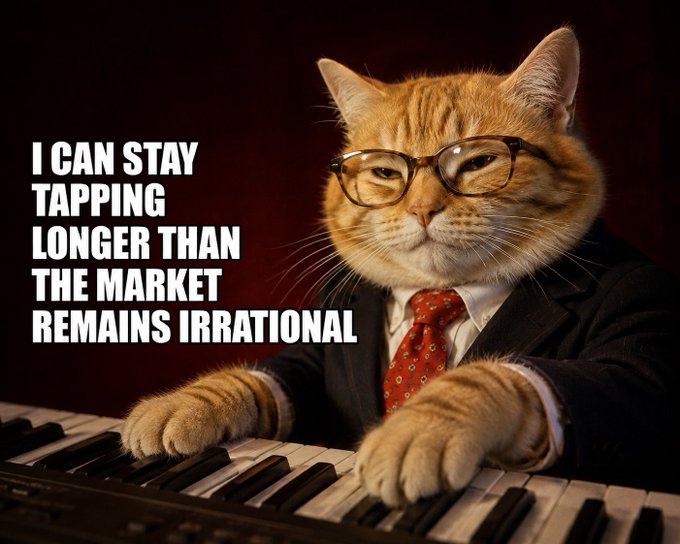 A meme image of an orange tabby cat wearing glasses, a suit, and red tie, sitting at a piano keyboard with the text 'I CAN STAY TAPPING LONGER THAN THE MARKET REMAINS IRRATIONAL'.