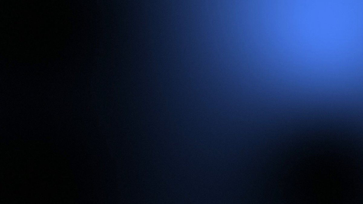 The image features a gray background with a blue gradient stripe running horizontally across the frame. The gradient transitions from black at the top left corner to white near the bottom right side, creating a visual illusion of depth. There is no text or additional elements in the image apart from these colors and lines.