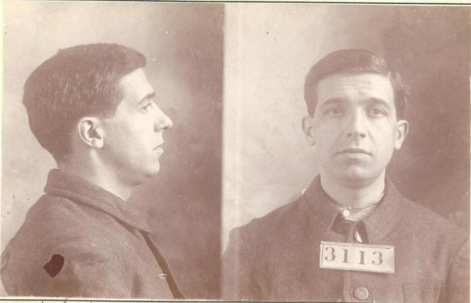 A sepia-toned mugshot shows a young man in profile and frontal views, wearing a dark uniform with an identification placard reading "3113." The post "Satoshi revealed" suggests this image is being presented as the long-rumored photograph of Satoshi Nakamoto, the pseudonymous creator of Bitcoin.