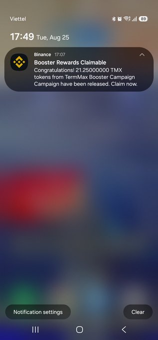 A smartphone screenshot showing a notification from the Binance app at 17:07 stating 'Booster Rewards Claimable: Congratulations! 21.25000000 TMX tokens from TermMax Booster Campaign have been released. Claim now.'