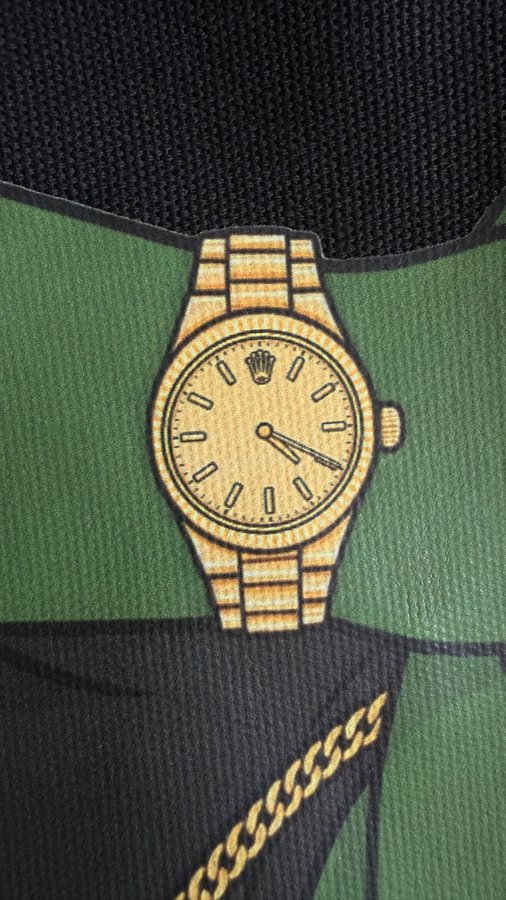 A printed graphic of a gold Rolex-style wristwatch is displayed on a green and black fabric background, with a gold chain visible at the bottom. The image ties into the post's teasing "bullish news" by using luxury watch and chain imagery as symbols of wealth, success, and impending fortune.