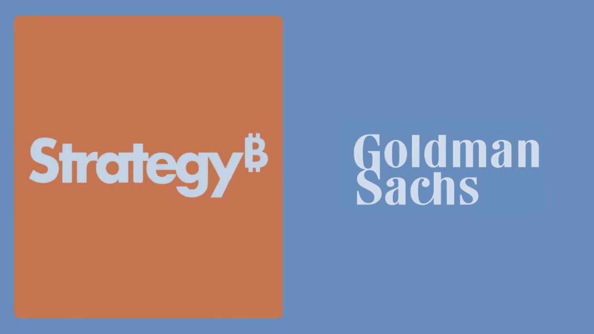 "Strategy" written above "Goldman" next to an orange square containing the word "Strategy". The two companies are related as they both deal with Bitcoin but have different positions in terms of involvement with this digital currency.
