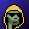 A small pixel art image showing a green-skinned character or alien wearing a yellow hood against a solid blue background.