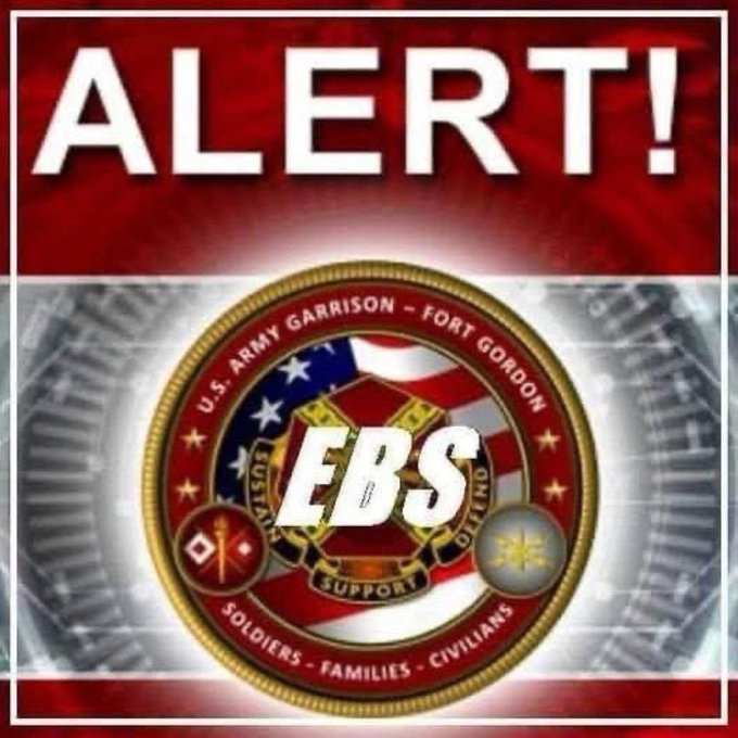 An 'ALERT!' graphic for Fort Gordon EBS (Emergency Broadcast System), featuring the U.S. Army Garrison seal and the motto 'SOLDIERS - FAMILIES - CIVILIANS'.