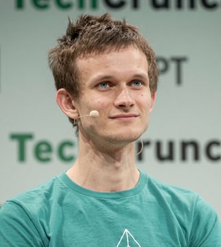 Vitalik Buterin, co-founder of Ethereum, appears at a TechCrunch event wearing a headset microphone, contextualizing the announcement of his "Lean Ethereum" roadmap aimed at enhancing the blockchain's speed, affordability, and quantum resistance.