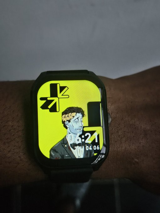 The image features a wristwatch with a cartoon character design, specifically a man wearing a crown. The watch has a black band and yellow face, making it stand out against the white background of the photo. The cartoon character appears to be wearing a crown, which is often associated with royalty or leadership roles. The post includes a quote that reads "Gm CT Predict on @trylimitless Stay limitless Have a wonderful Day Champs". This quote adds a touch of humor and positivity to the image, as it combines the watch's design elements with an entertaining and uplifting message.