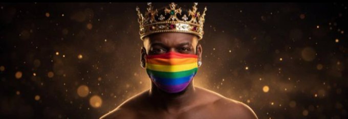 The image shows a shirtless Black man wearing an ornate gold crown and a rainbow Pride flag face mask against a sparkly golden background. This appears to be promotional imagery being referenced in the post as a "psyop" banner for a "Trump coin" cryptocurrency, though the image itself contains no visible text, tickers, or coin names.