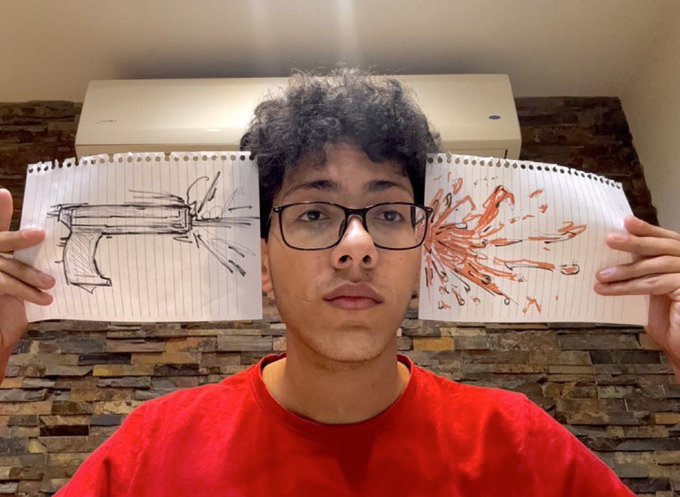 A young man in a red shirt and glasses holds up two spiral notebooks, displaying a black-and-white sketch of a gun on one and an orange splatter resembling blood on the other.