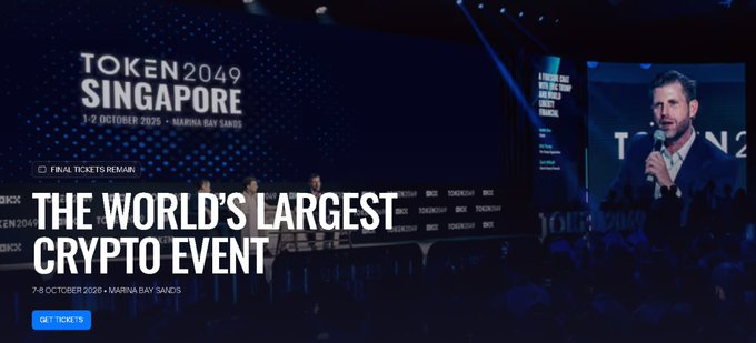 The image is a promotional banner for TOKEN2049 Singapore, held on 7-8 October 2026 at Marina Bay Sands, billed as "THE WORLD'S LARGEST CRYPTO EVENT." It features a speaker on stage with a microphone in front of the event's branded backdrop, with the message "FINAL TICKETS REMAIN" and a "GET TICKETS" call-to-action button. The visual aligns with the post's excitement about the upcoming conference and its 25,000+ attendees from the global crypto industry.