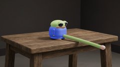 A 3D-rendered green frog wearing a blue sweater sits on a wooden table, with a long stick-like object extending from its mouth.