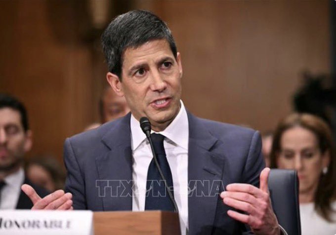 A man in a dark suit speaks at a Senate hearing, with a nameplate reading 'HONORABLE' and a TTX News watermark visible.