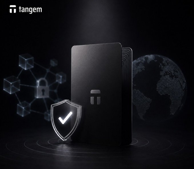 The image features Tangem's sleek black hardware wallet card prominently displayed against a dark background, accompanied by a glowing security shield with a checkmark and a digital globe, reinforcing the post's emphasis on self-custody and independence from company survival.