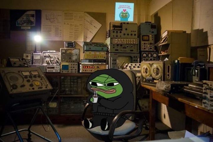 A Pepe the Frog character in a black hoodie sits in a chair drinking from a coffee mug labeled "Happy Friday" inside a dimly lit room filled with vintage electronic equipment. The meme ties to the post's Friday greeting, with Pepe representing a relaxed Friday vibe paired with the BeldexCoin promotion.