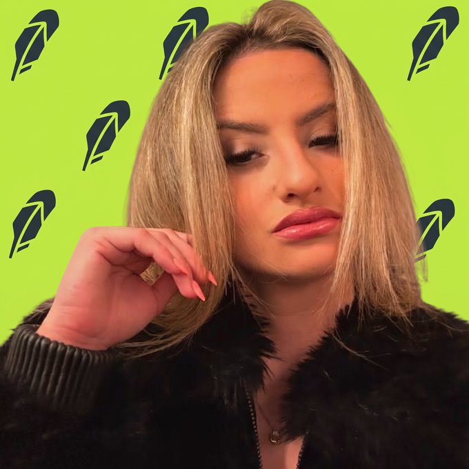 A blonde woman in a black fur-trimmed jacket poses with her eyes closed, set against a bright green background patterned with black leaf-like symbols.