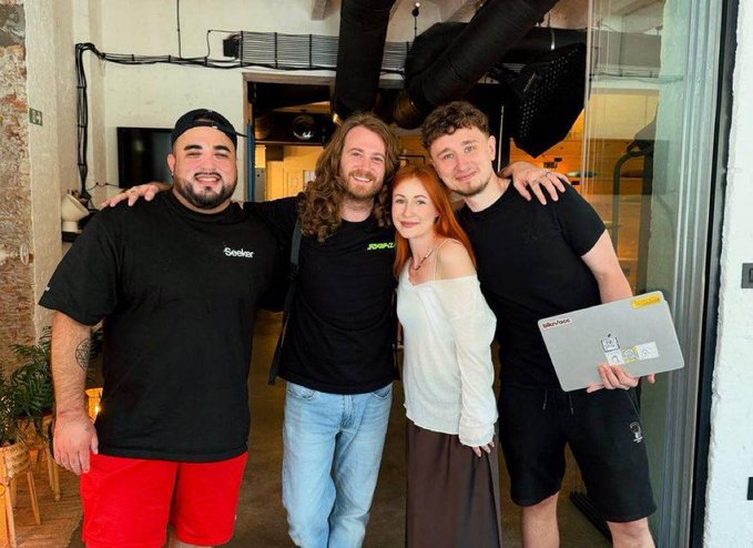 Four people pose together smiling at what appears to be Solana Summit Belgrade, with one person holding a laptop displaying a SP3ND-branded screen, reflecting the team's successful pitch of their stablecoin shopping product to the crypto community.