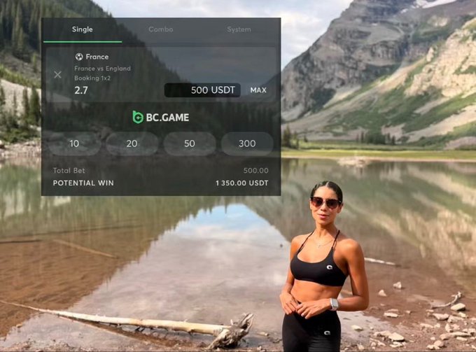 A woman in black athletic wear and sunglasses stands by a mountain lake, with a BC.GAME sports betting interface overlay showing a France vs England single bet at 2.7 odds for 500 USDT.