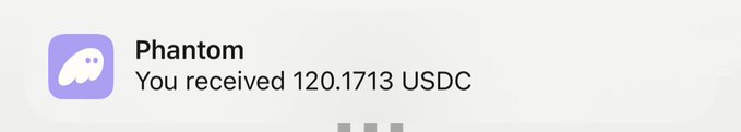 A Phantom wallet notification showing 'You received 120.1713 USDC' with the purple ghost logo.