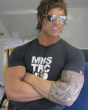 The image features a man with short brown hair, wearing sunglasses and a black t-shirt that has white text on it. He also has tattoos on his arm. The caption of the image reads "we are all gonna make it brah. $TIBBIR". This phrase is likely an inside joke or reference to a popular song by a band named "Tibbies".